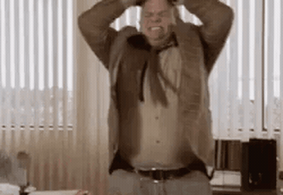 Man In Suit And Tie With Hands On Head GIF