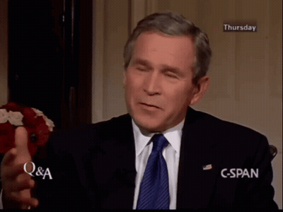 Man In Suit And Tie With Hands On Head GIF