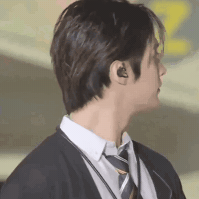 Man In Suit And Tie With Headphones GIF