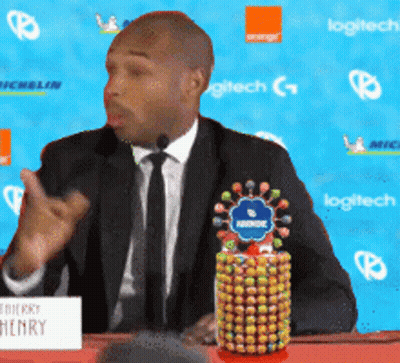 Man In Suit And Tie With Henry Sign GIF