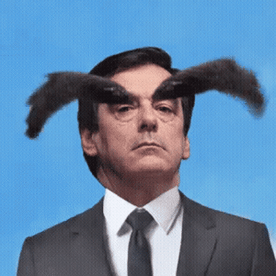 Man In Suit And Tie With Horns GIF