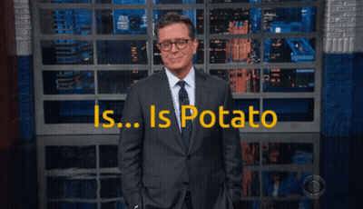 Man In Suit And Tie With Is Potato Sign GIF