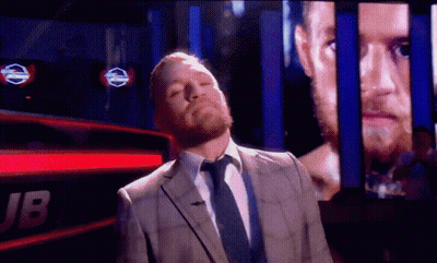 Man In Suit And Tie With Jb Screen GIF