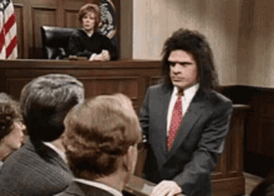Man In Suit And Tie With Judge GIF