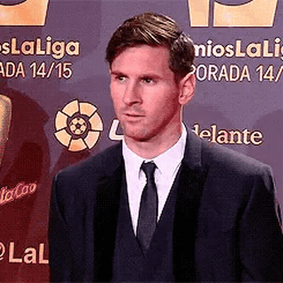 Man In Suit And Tie With Laliga Sign GIF