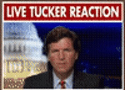 Man In Suit And Tie With Live Tucker Reaction Sign GIF