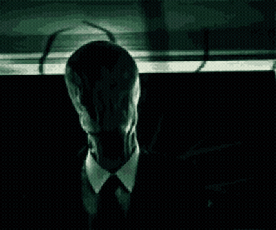 Man In Suit And Tie With Long Face GIF