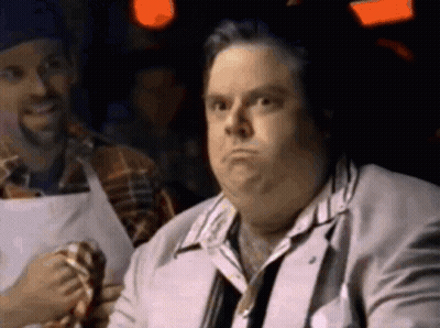 Man In Suit And Tie With Man In Apron GIF