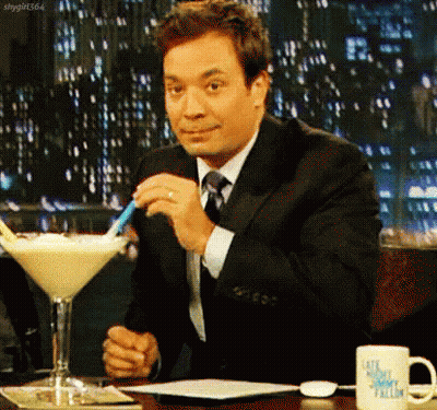 Man In Suit And Tie With Martini GIF