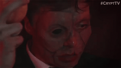 Man In Suit And Tie With Mask GIF
