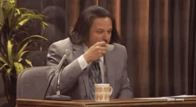 Man In Suit And Tie With Microphone Coffee GIF