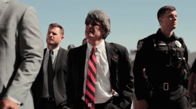 Man In Suit And Tie With N On Shirt GIF