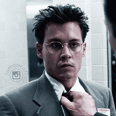 Man In Suit And Tie With Name Tag Saying Johnnydcpp Gifs GIF