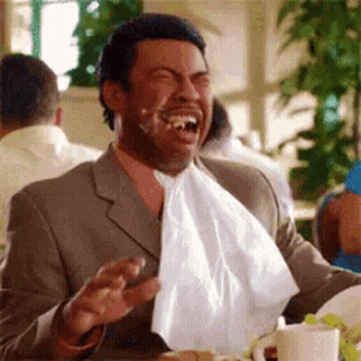 Man In Suit And Tie With Napkin Around Mouth GIF