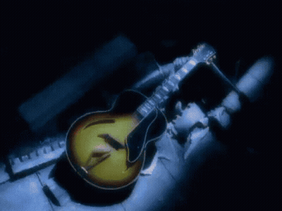 Man In Suit And Tie With Noir On Head GIF