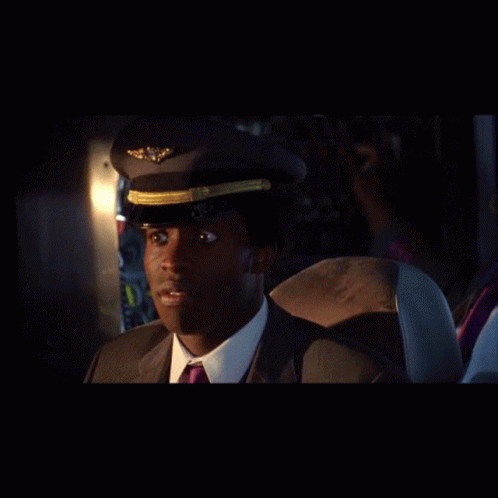 Man In Suit And Tie With Pilot Hat GIF