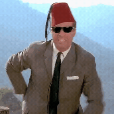 Man In Suit And Tie With Red Fez And Sunglasses GIF