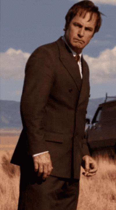 Man In Suit And Tie With Ribbon GIF