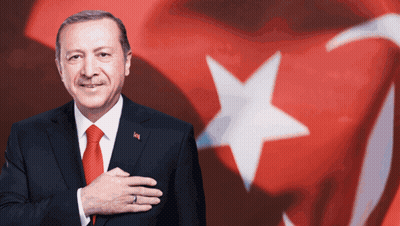 Man In Suit And Tie With Ring Before American Flag GIF