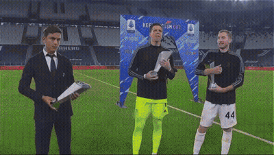 Man In Suit And Tie With Soccer Players Holding Trophies GIF