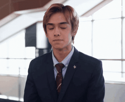 Man In Suit And Tie With Star GIF