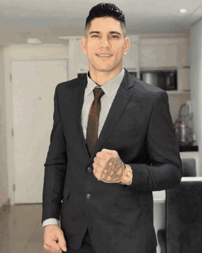 Man In Suit And Tie With Tattoo GIF