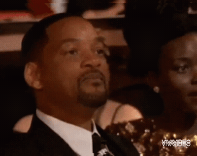 Man In Suit And Tie With Tongue Out GIF