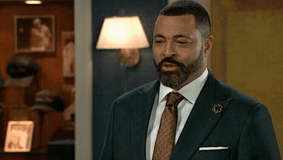 Man In Suit And Tie With U.S. Army Pin GIF