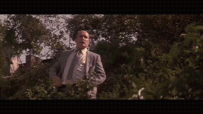 Man In Suit And Tie With Word Defense GIF