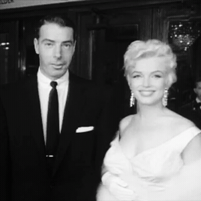 Man In Suit And Tie, Woman In Dress GIF