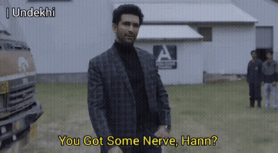 Man In Suit And Turtleneck Talking GIF