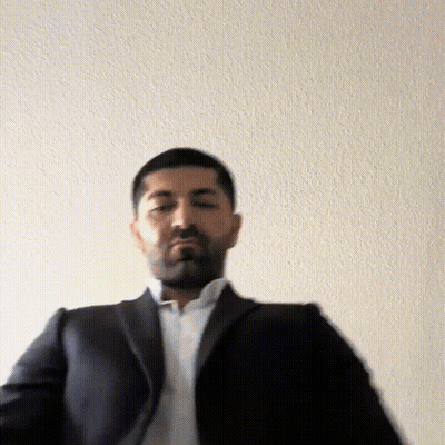 Man In Suit And White Shirt Standing GIF