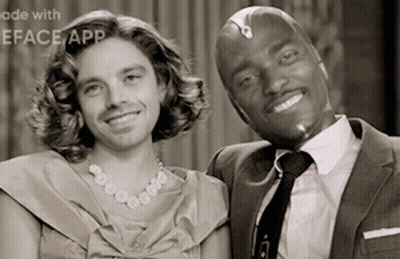 Man In Suit And Woman In Dress Smiling GIF