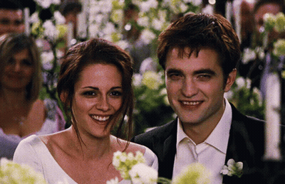 Man In Suit And Woman In Wedding Dress Smiling GIF