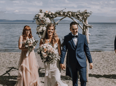 Man In Suit And Woman In Wedding Dress Smiling GIF