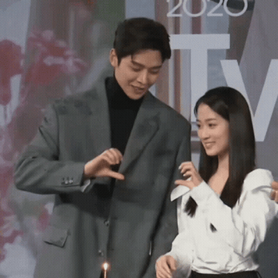 Man In Suit And Woman In White Shirt With 2020 GIF
