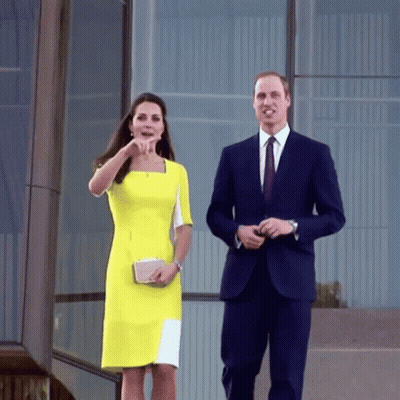 Man In Suit And Woman In Yellow Dress Walking GIF