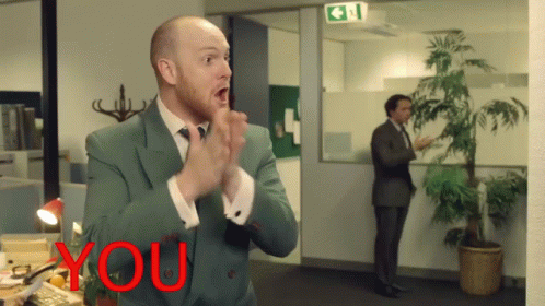 Man In Suit Applauding In Front Of Sign Saying You GIF