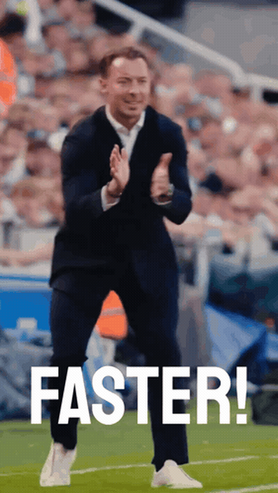 Man In Suit Applauds Saying Faster On Soccer Field GIF