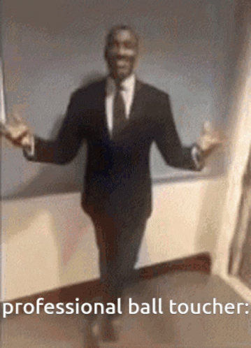 Man in Suit Arms Outstretched Says Professional Ball Toucher