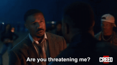 Man In Suit Asking Are You Threatening Me GIF