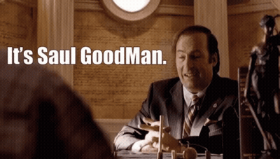 Man In Suit At Desk Saying It's Saul Goodman GIF