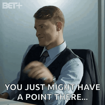 Man In Suit At Desk Saying You Just Might Have A Point There GIF