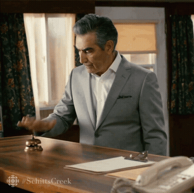 Man In Suit At Desk With Bell #Schitts Creek GIF
