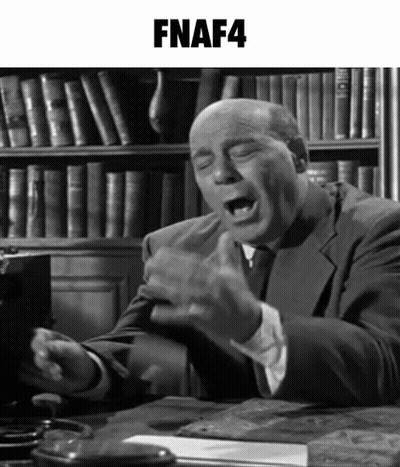 Man In Suit At Desk With FNAF4 Bookshelf GIF