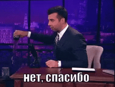 Man In Suit At Desk With Foreign Language GIF