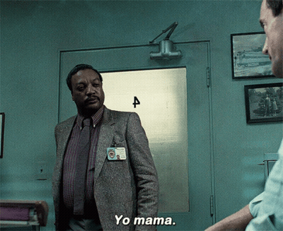 Man In Suit At Door Number Four GIF