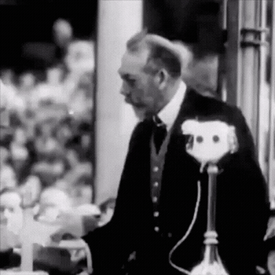 Man In Suit At Microphone GIF