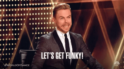 Man In Suit At Microphone: Let's Get Funky GIF