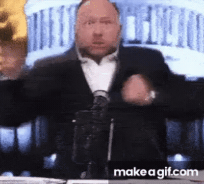 Man In Suit At Microphone GIF